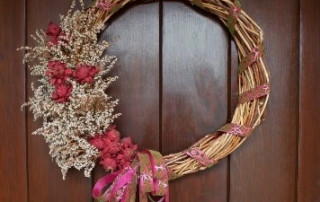 A Trumpet vine wreath decorates for season