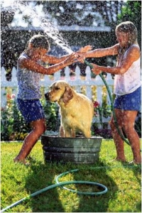 Kids playing in water. Be aware and look for ways to save water in gardens.